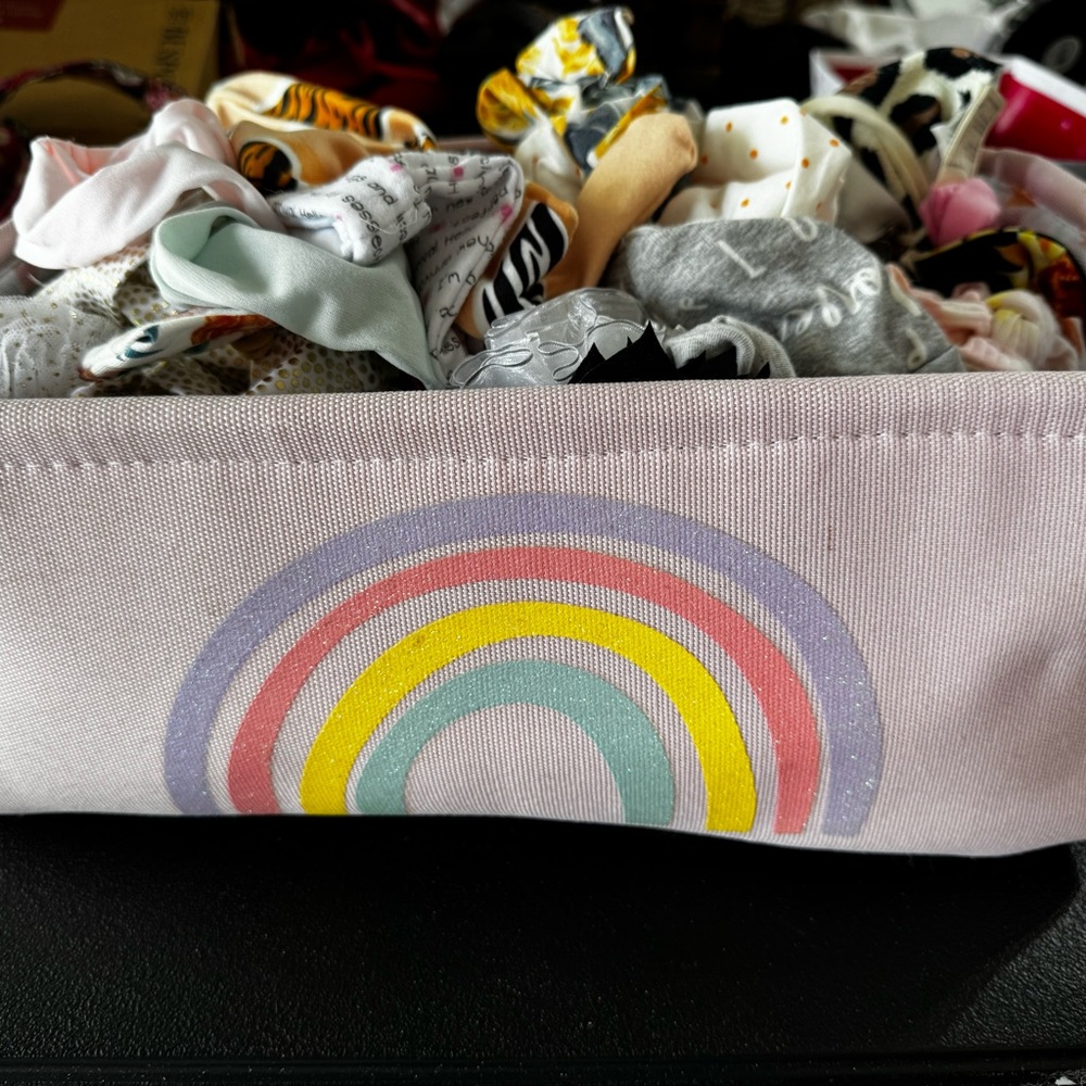 Entire Rainbow Kids Storage Basket full of headbands and bows